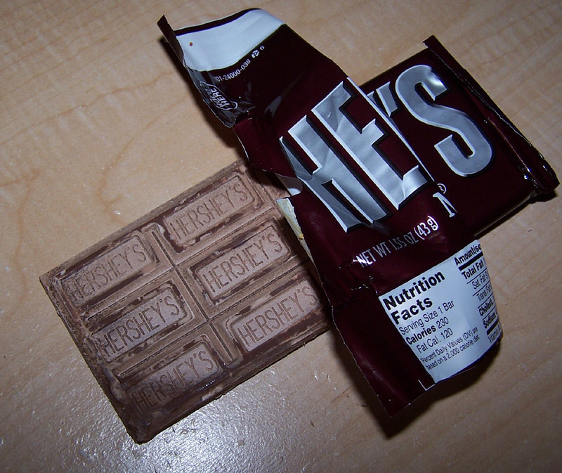 An unwrapped Hershey&#x27;s bar on a countertop.