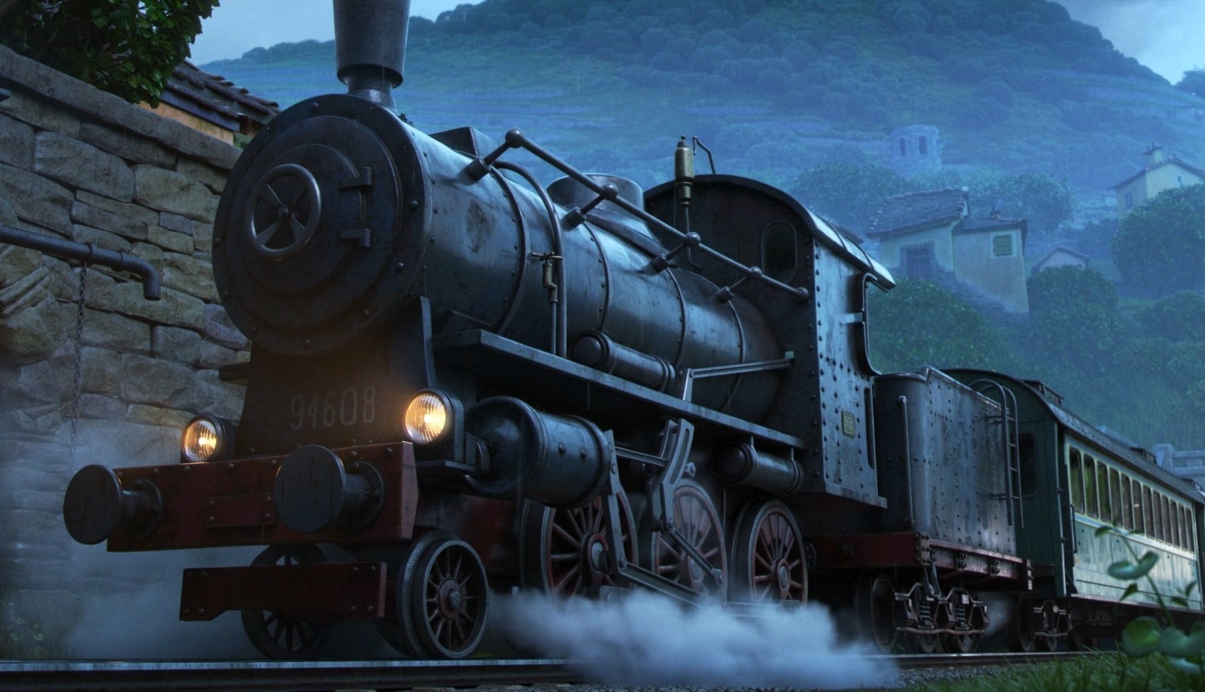 A steam engine standing at a station.