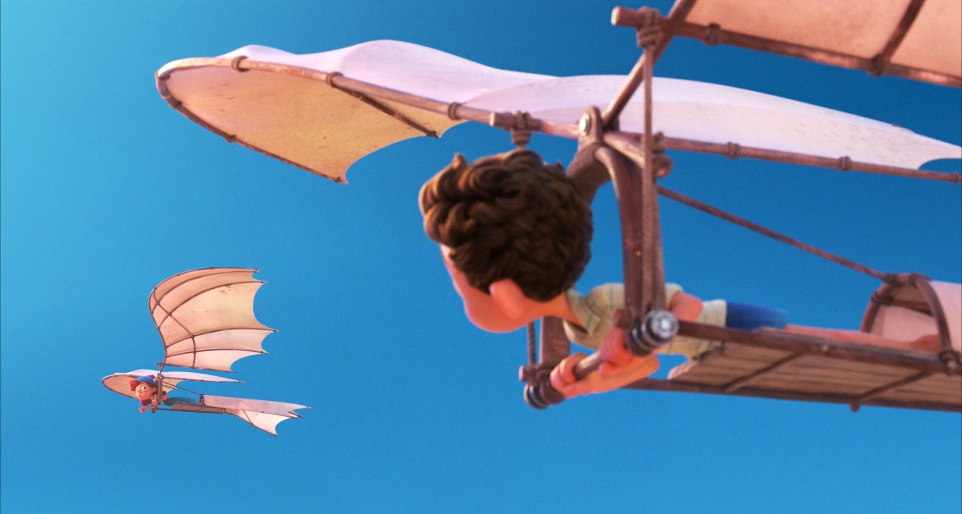 A girl and a boy flying in two contraptions