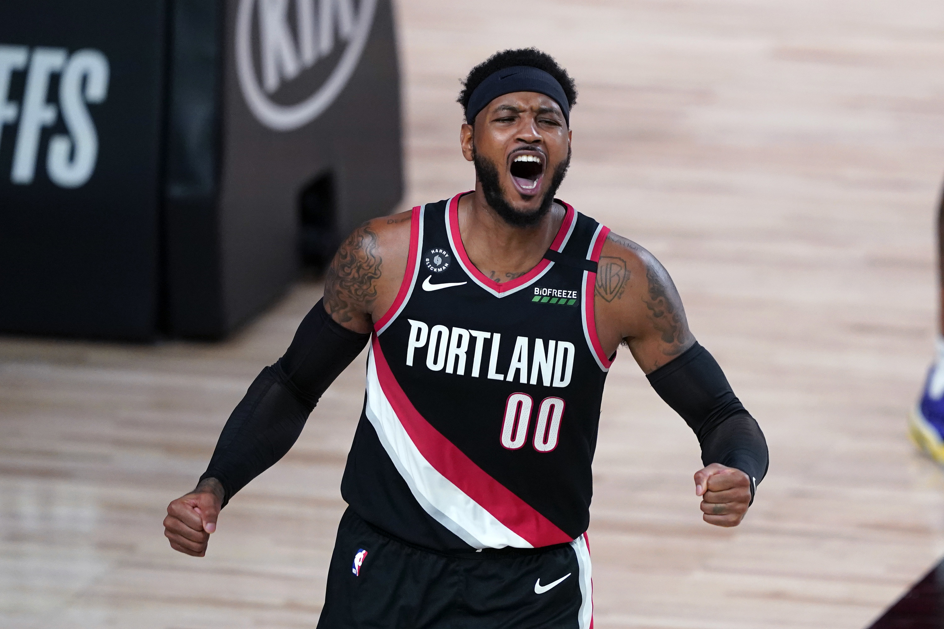 Black Portland jersey with a red and white sash going down the middle
