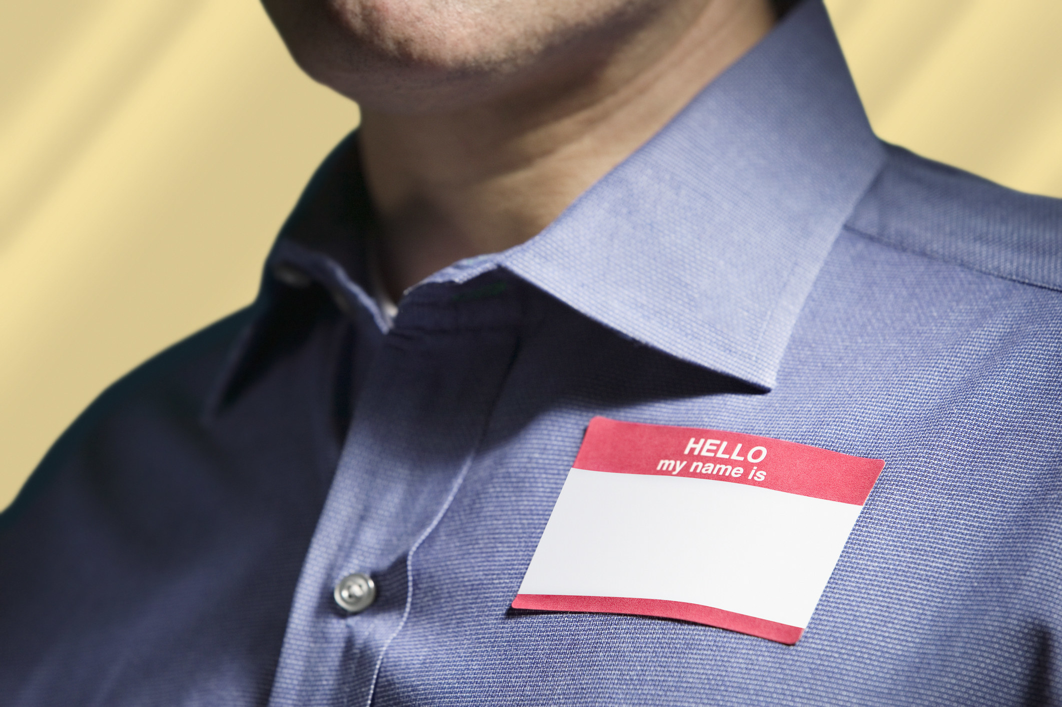 A blank &quot;Hello, my name is...&quot; tag on a man&#x27;s shirt
