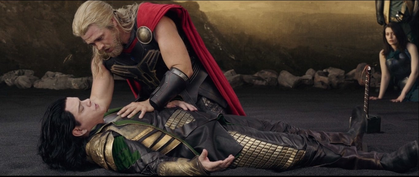 A fake Thor leans over a fake Loki played by Matt Damon