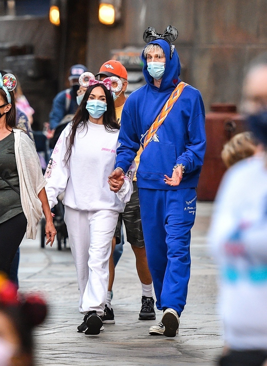 they wore his and hers sweatsuits and mouse ears