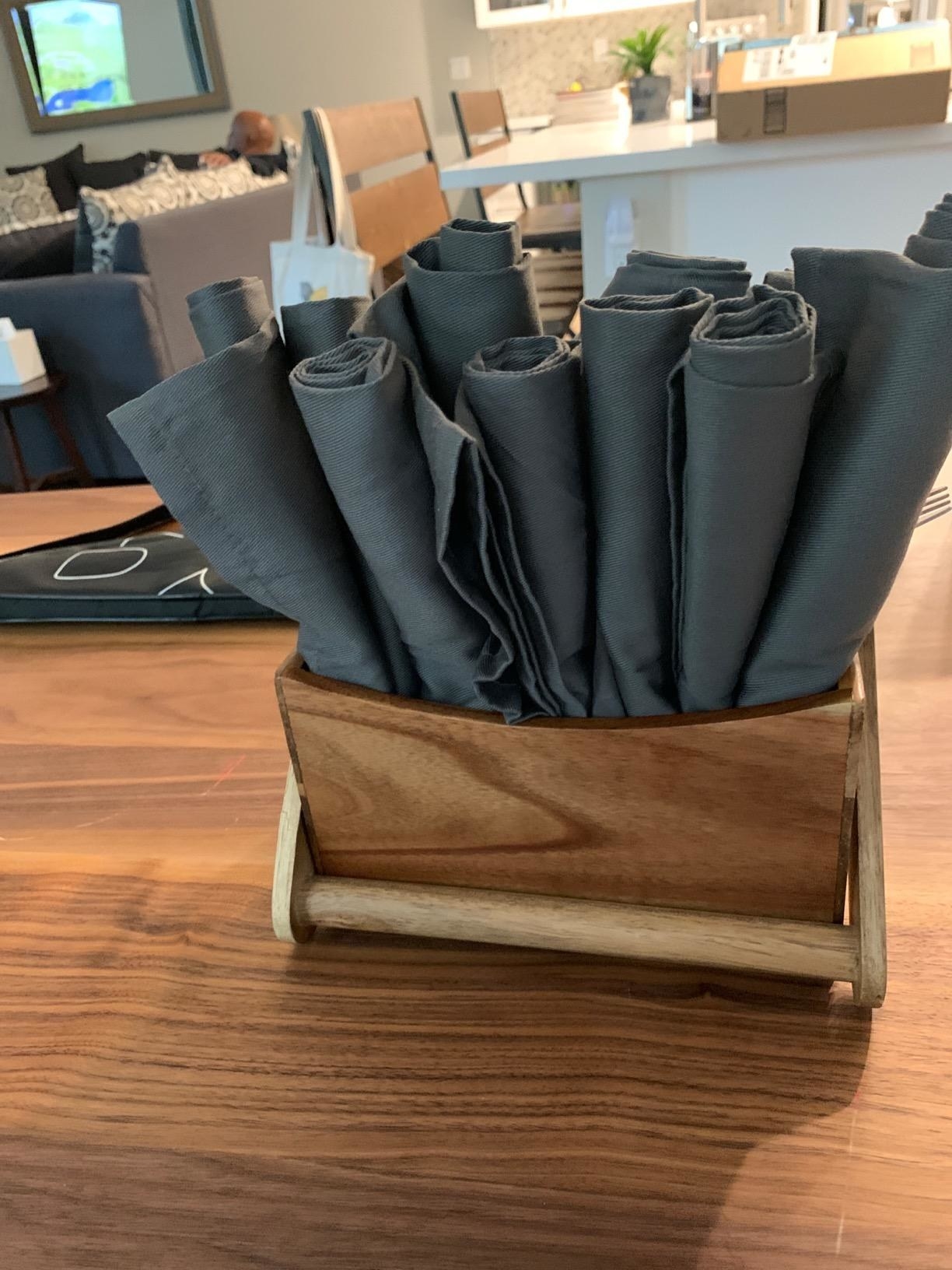 reviewer image of 12 rolled charcoal dinner napkins in a box