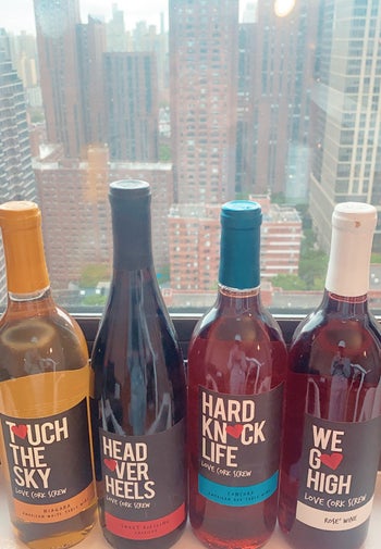 Four bottles of wine in white, red, and rosé varieties 