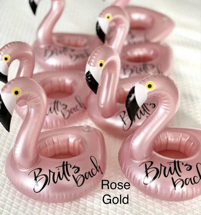 Several flamingo cup holding pool toys that say &quot;Britt&#x27;s Bach&quot;