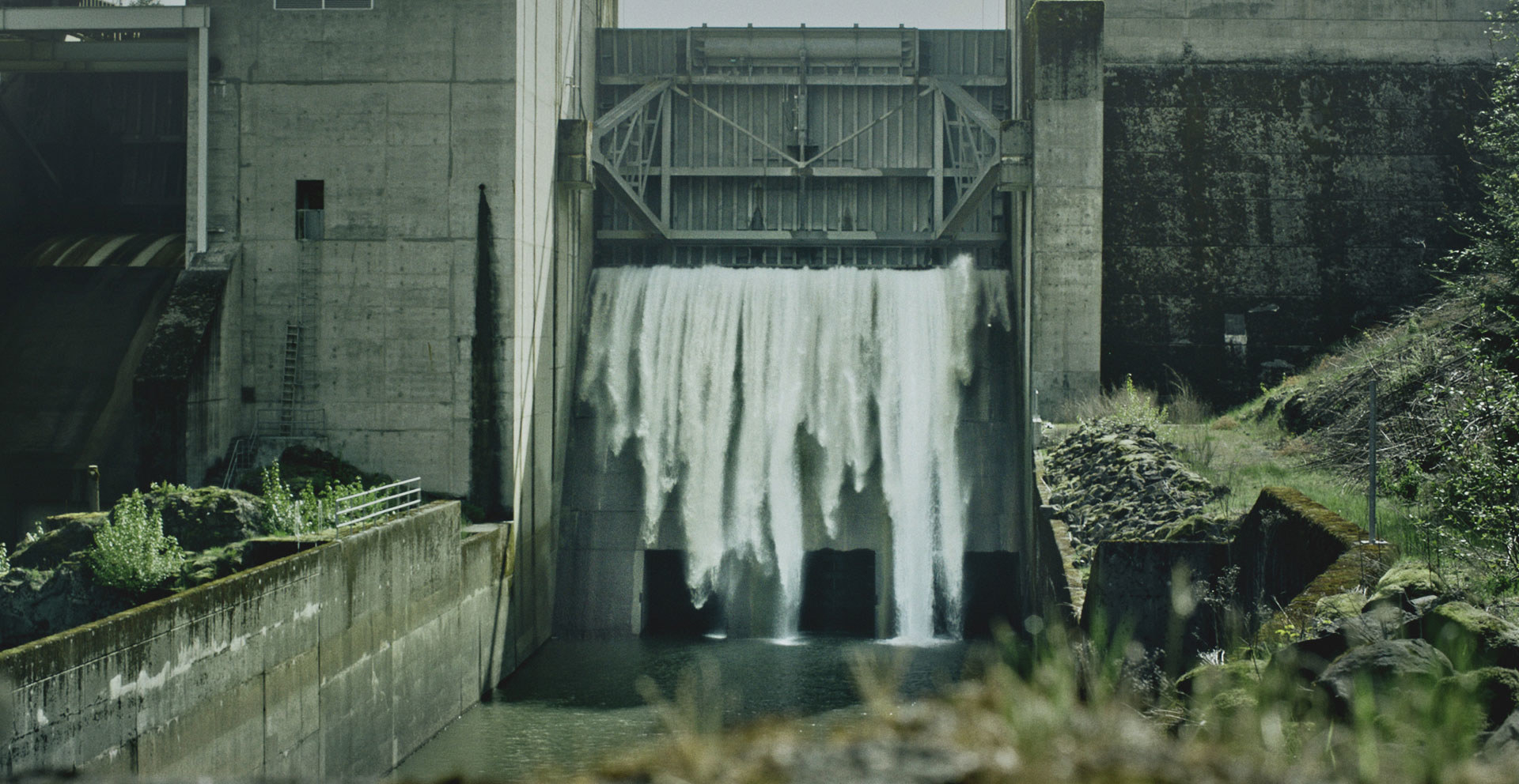 Water is released from holding in a hydroelectric dam.