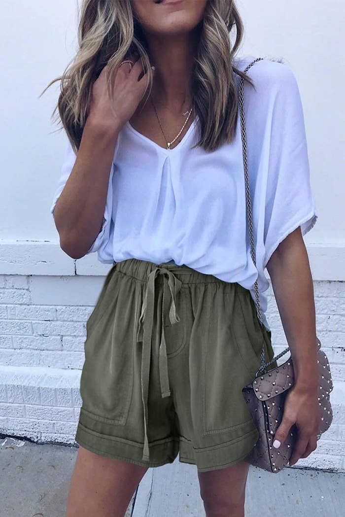 a person wearing the loose-fitted shorts with a blouse