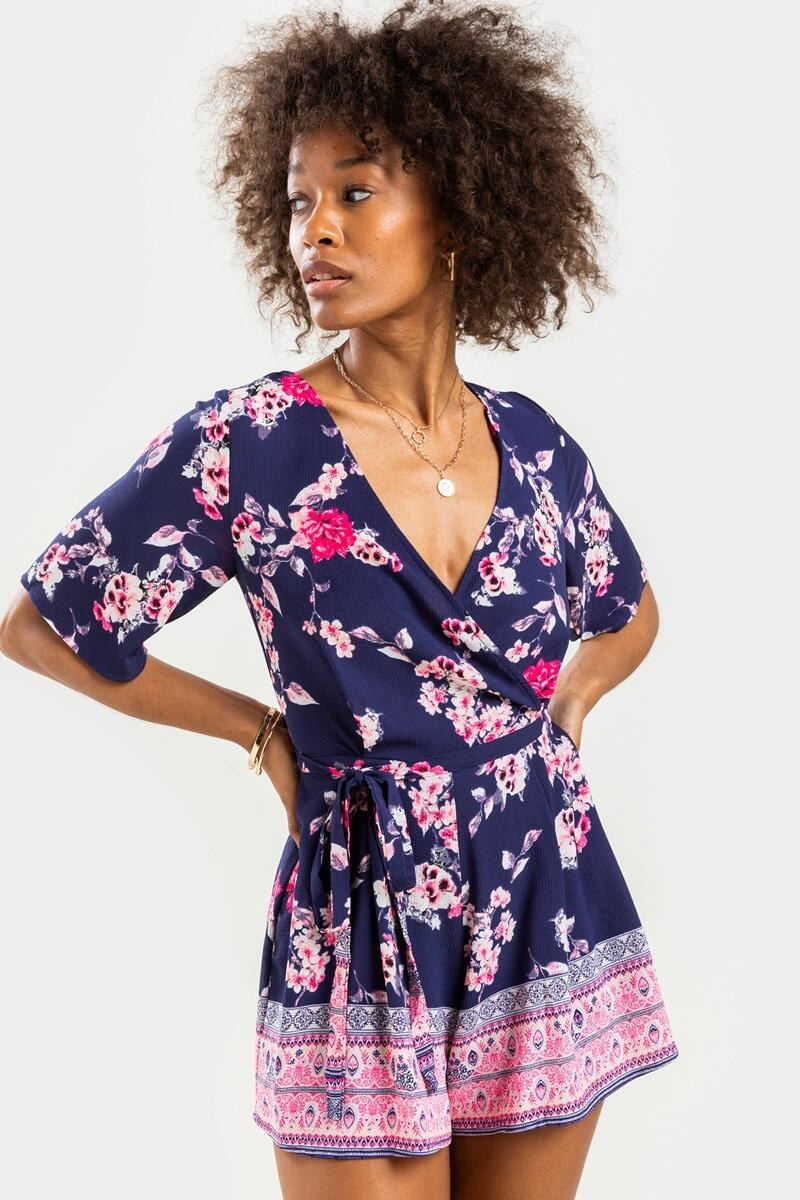 model wearing blue and pink romper