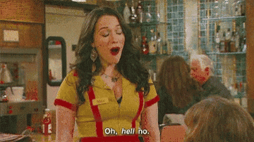 Kat Dennings waiting on a table in the show &quot;Two Broke Girls.&quot;