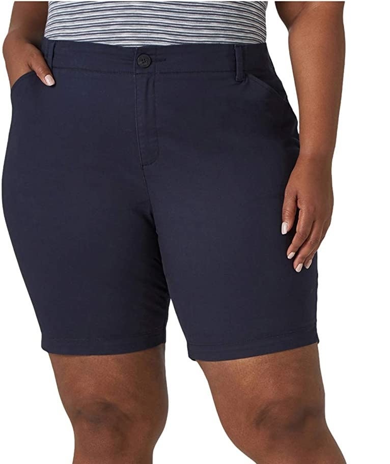 a person wearing the long bermuda shorts