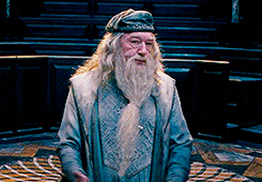 Dumbledore spreading his hands then putting them on his hips