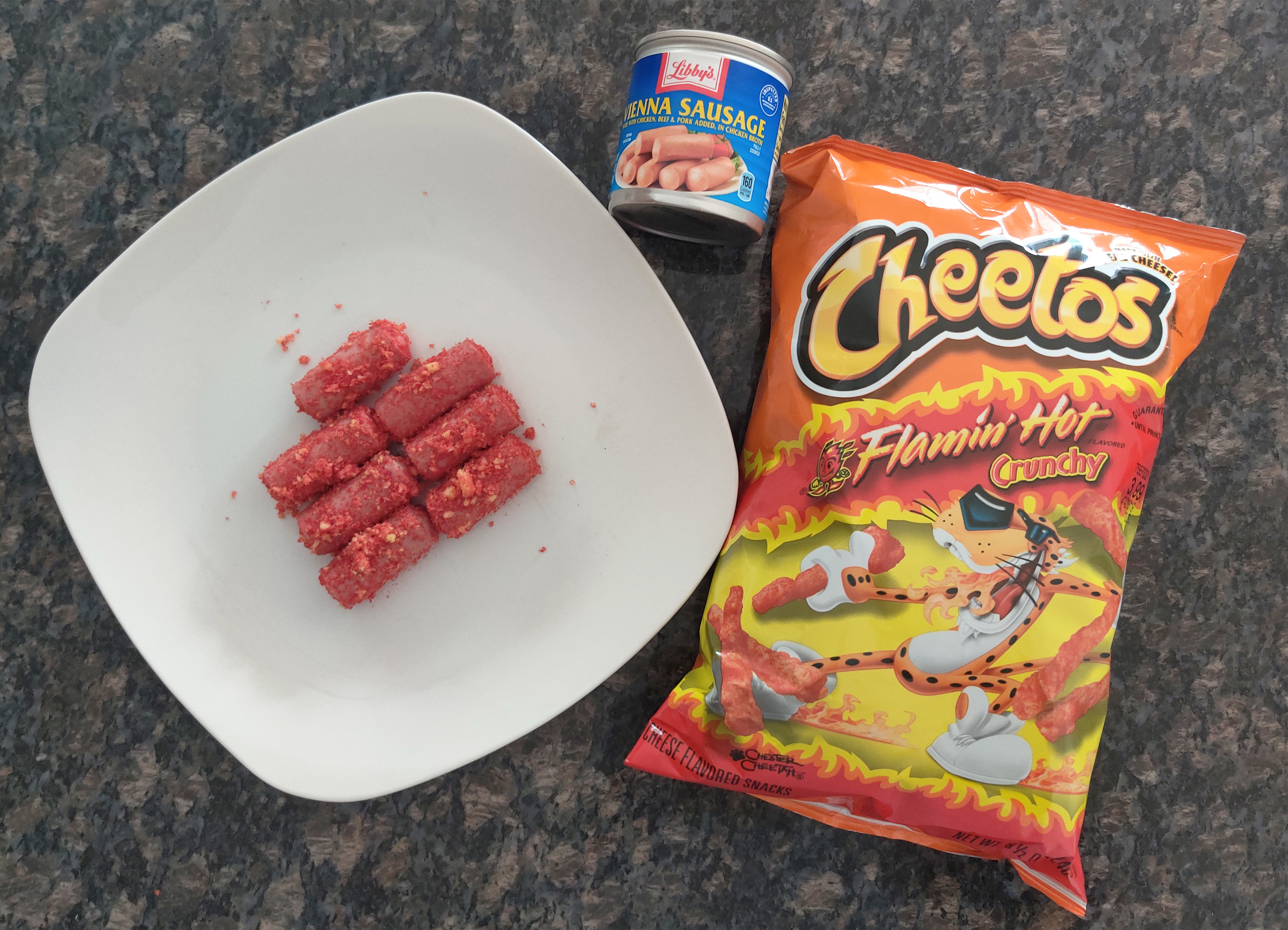 The full display of the recipe: Hot Cheetos, Vienna sausage, and a plate of the Cheeto-covered sausages