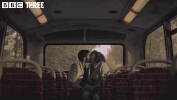 Tom and Jessie kissing on bus