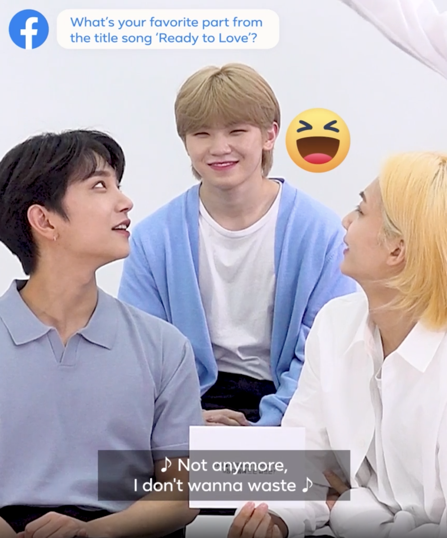 Woozi looking uncomfortable but laughing
