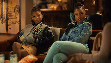 Sky and Jazz from &quot;Grownish&quot; turning toward someone talking