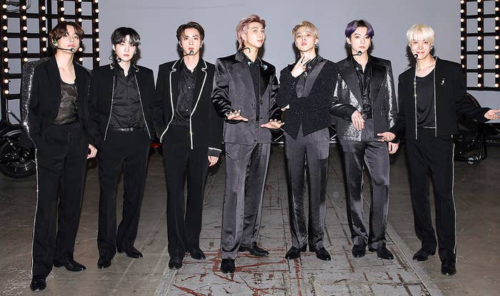 BTS wear dark suits on set for the Billboard Music Awards