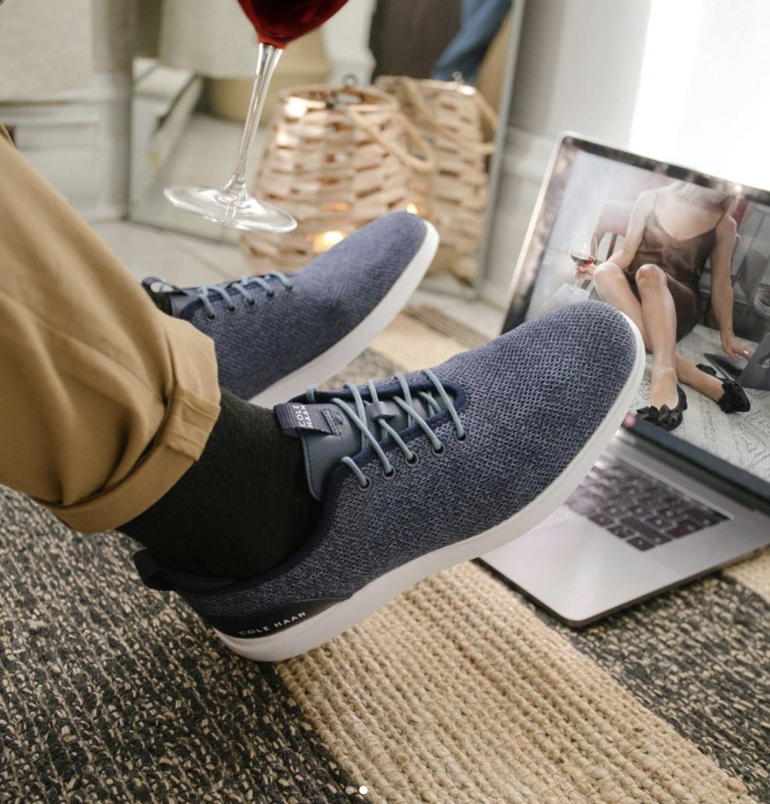 person with his feet up while video chatting