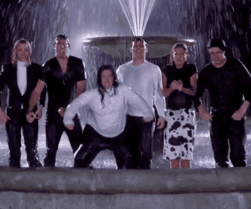 The cast members of Friends posing in a water fountain from the episode, ‘The One One That Could Have Been”