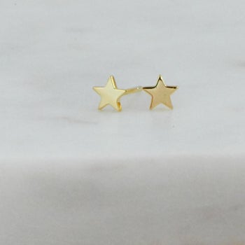 tiny, gold star-shaped earrings