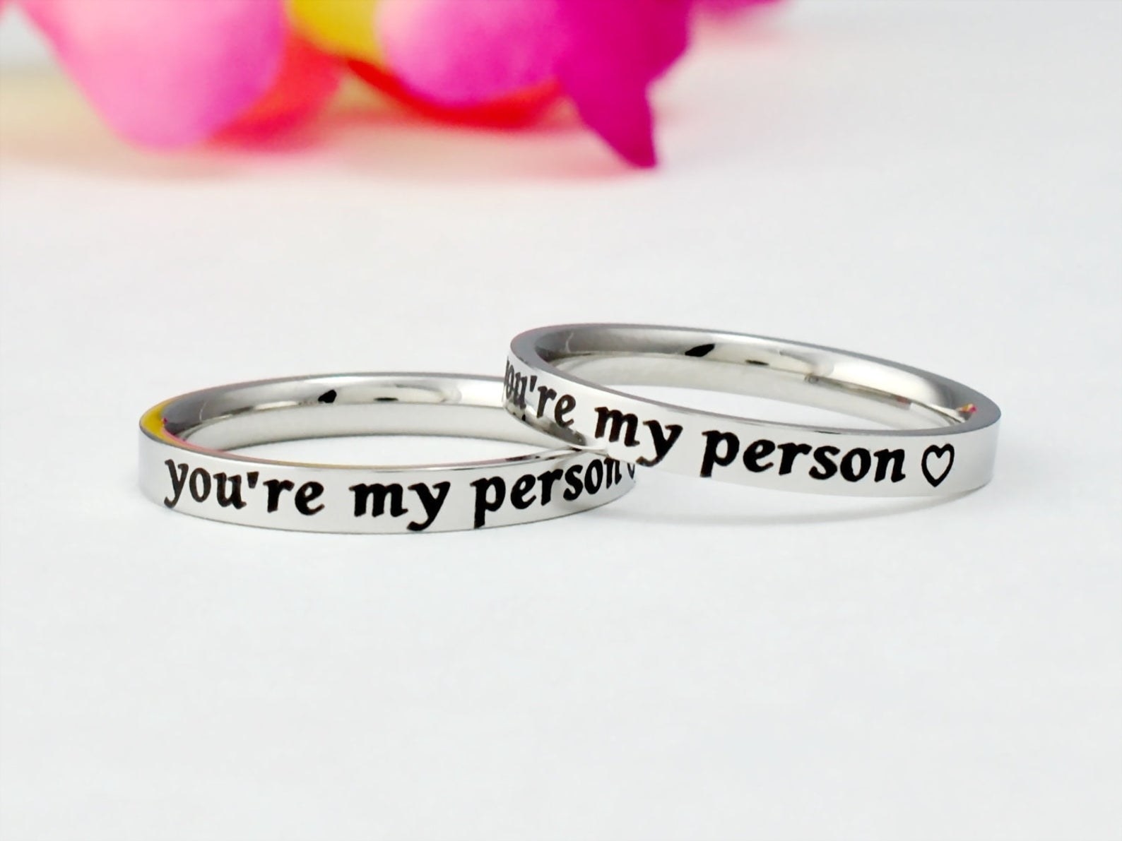 two silver rings that say &quot;you&#x27;re my person&quot; on them and a heart