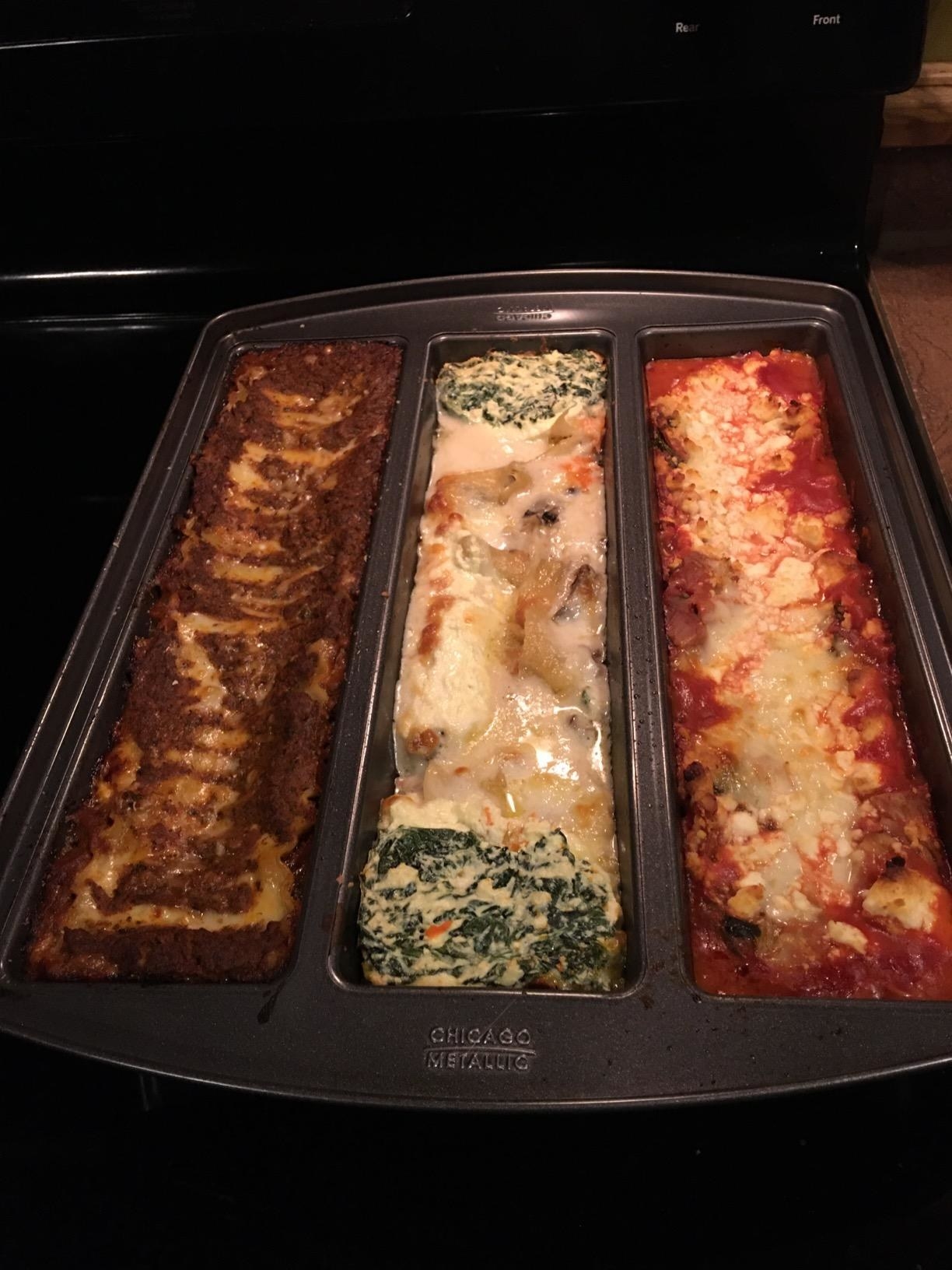 a reviewer photo with three different types of lasagna in the pan after baking