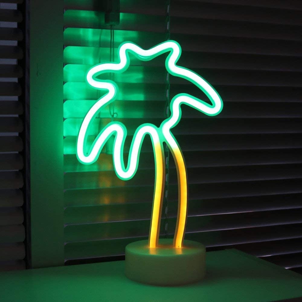 a palm tree shaped neon light