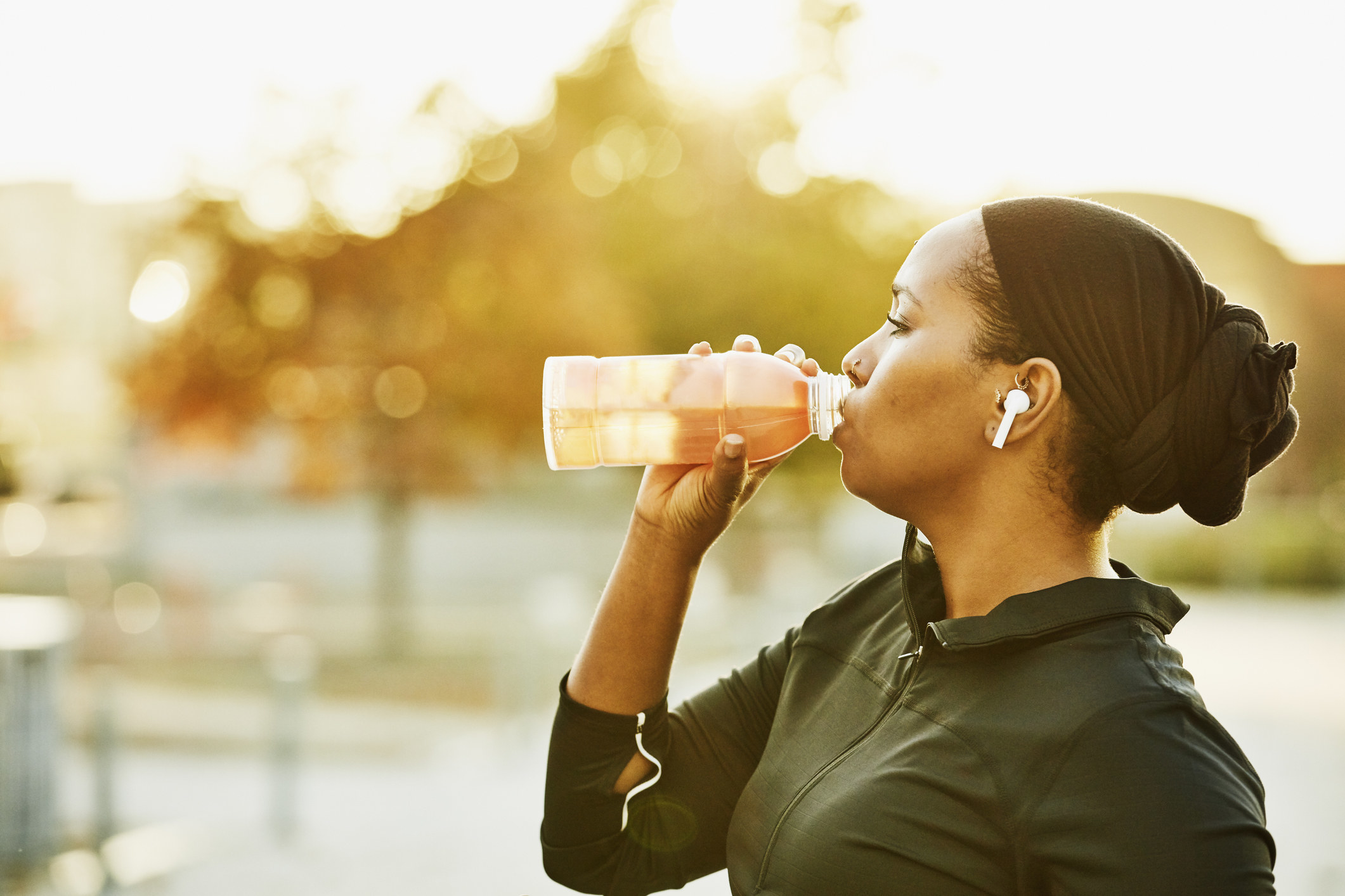 A Muslim woman drinking water