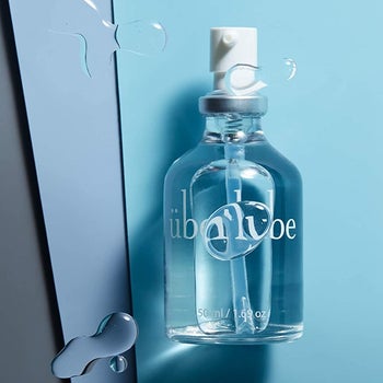 Uberlube bottle on blue background surrounded by smears