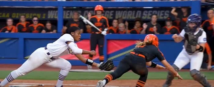 James Madison softball pitcher dives to tag Oklahoma State runner at home