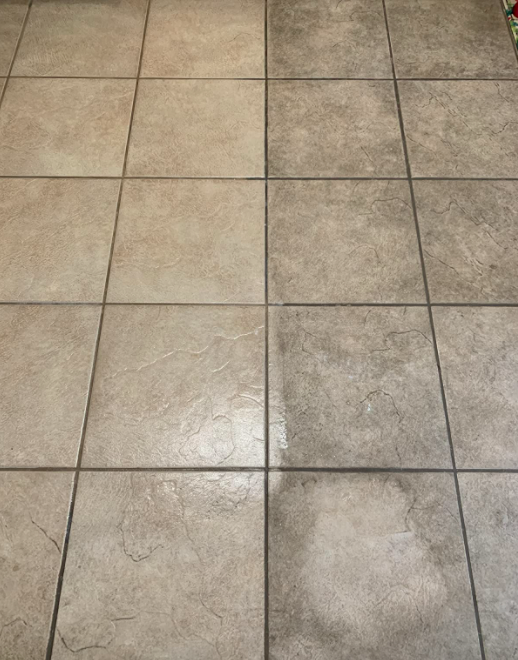 A customer review photo of their half dirty and half clean tile floor