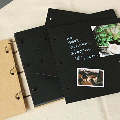The scrapbook has black pages. There are photos and captions on the opened page.