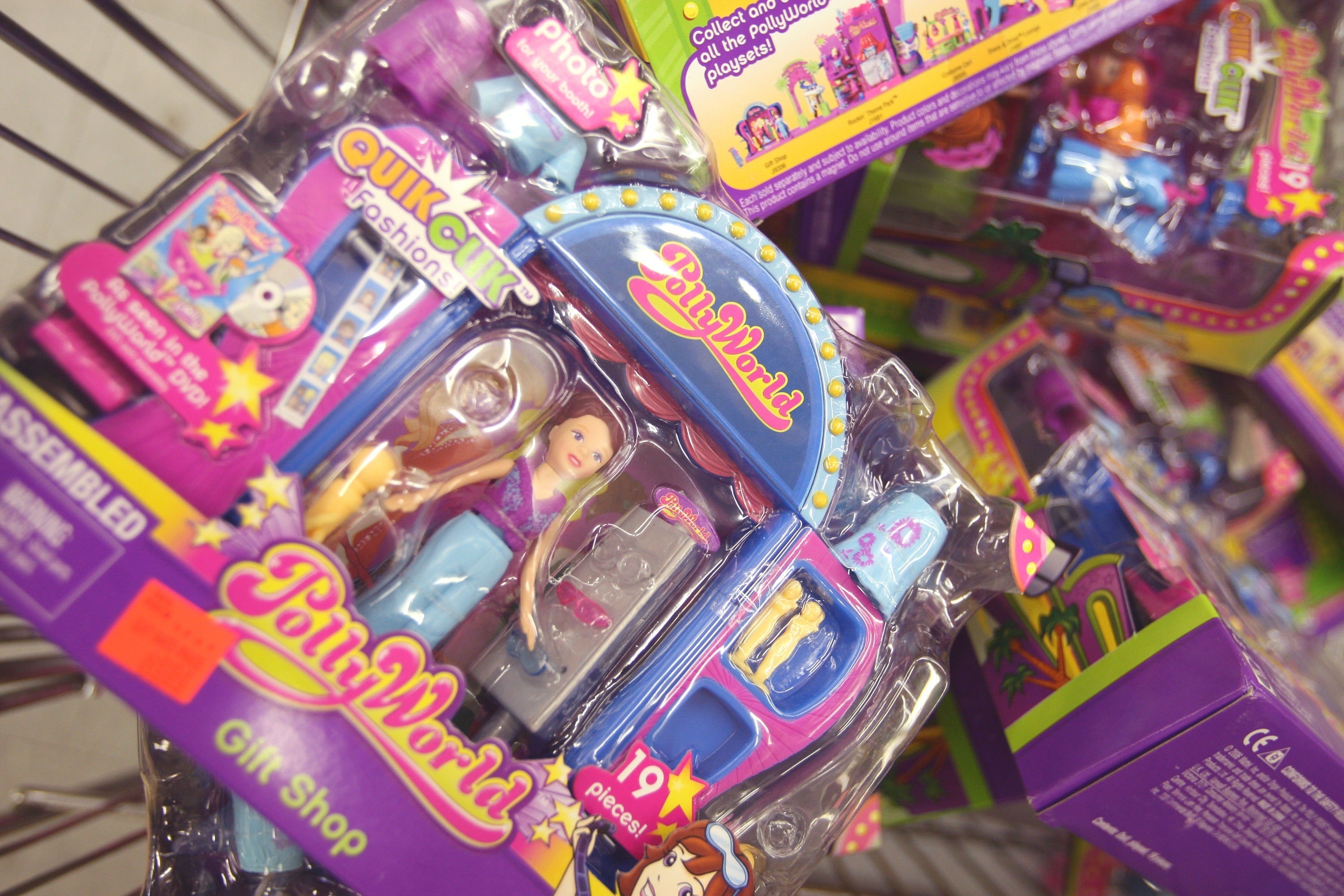 A stack of Polly Pockets in a shopping cart