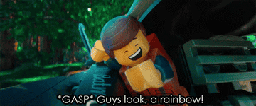 In this gif from &quot;The Lego Movie,&quot; a lego man sticks his head out of a movie vehicle and shouts, &quot;Gasp! Guys look, a rainbow!&quot;