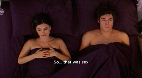 Woman and man looking very awkward in bed after sex