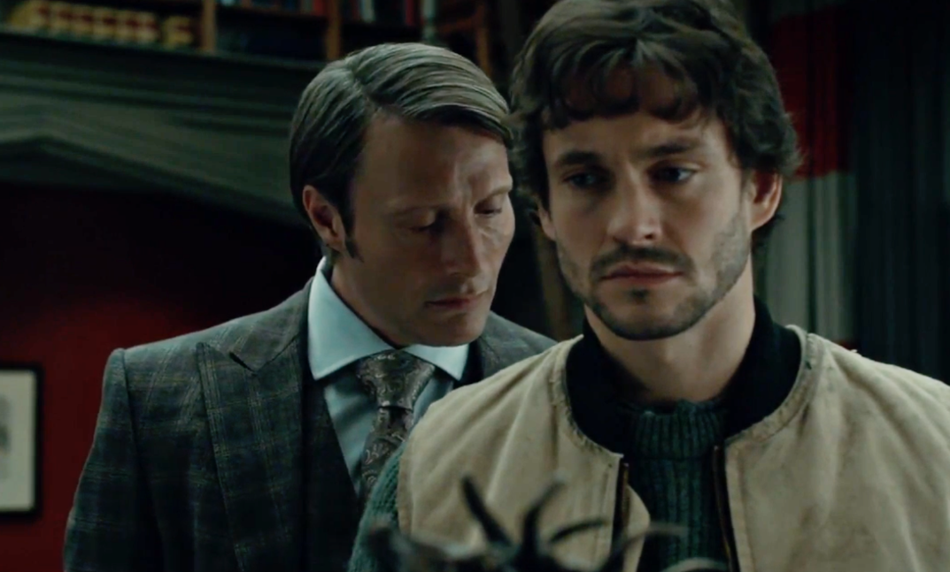 Hannibal Lecter leans in to smell the back of Will Graham&#x27;s neck as he is turned away from him