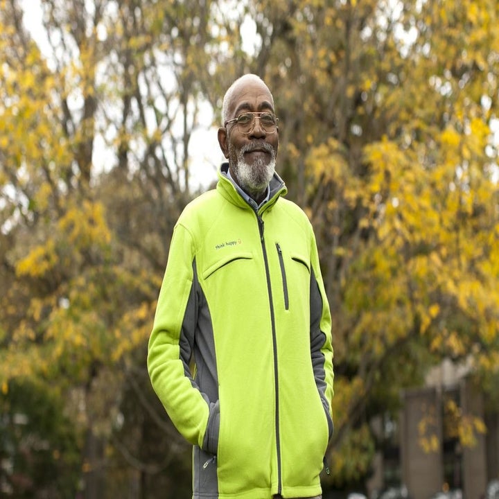 man wearing a lime green and gray fleece jacket