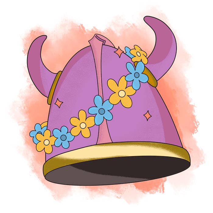 A viking helmet with a wreath of flowers draped across the horns