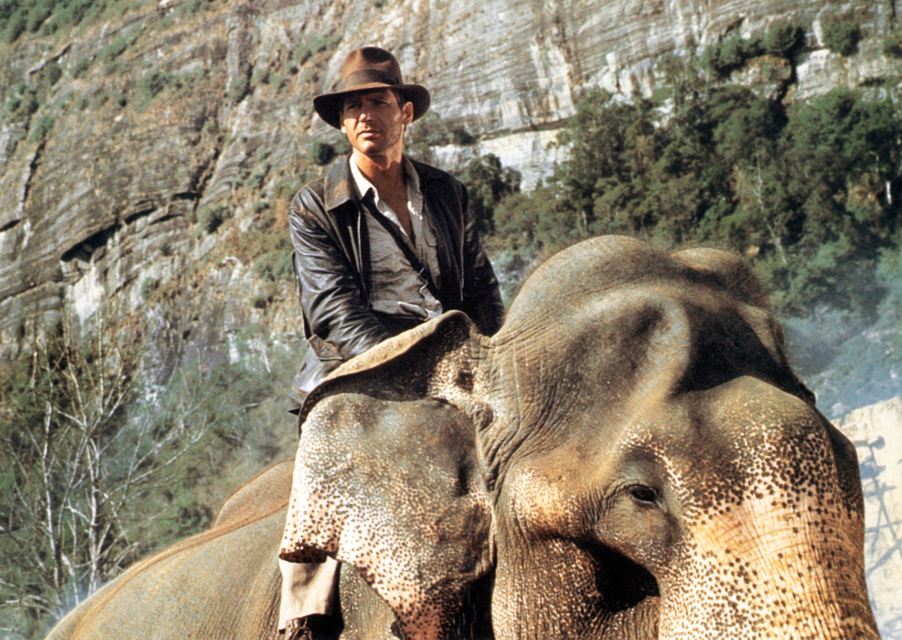 Harrison Ford as Indiana Jones riding an elephant in &quot;Indiana Jones&quot;