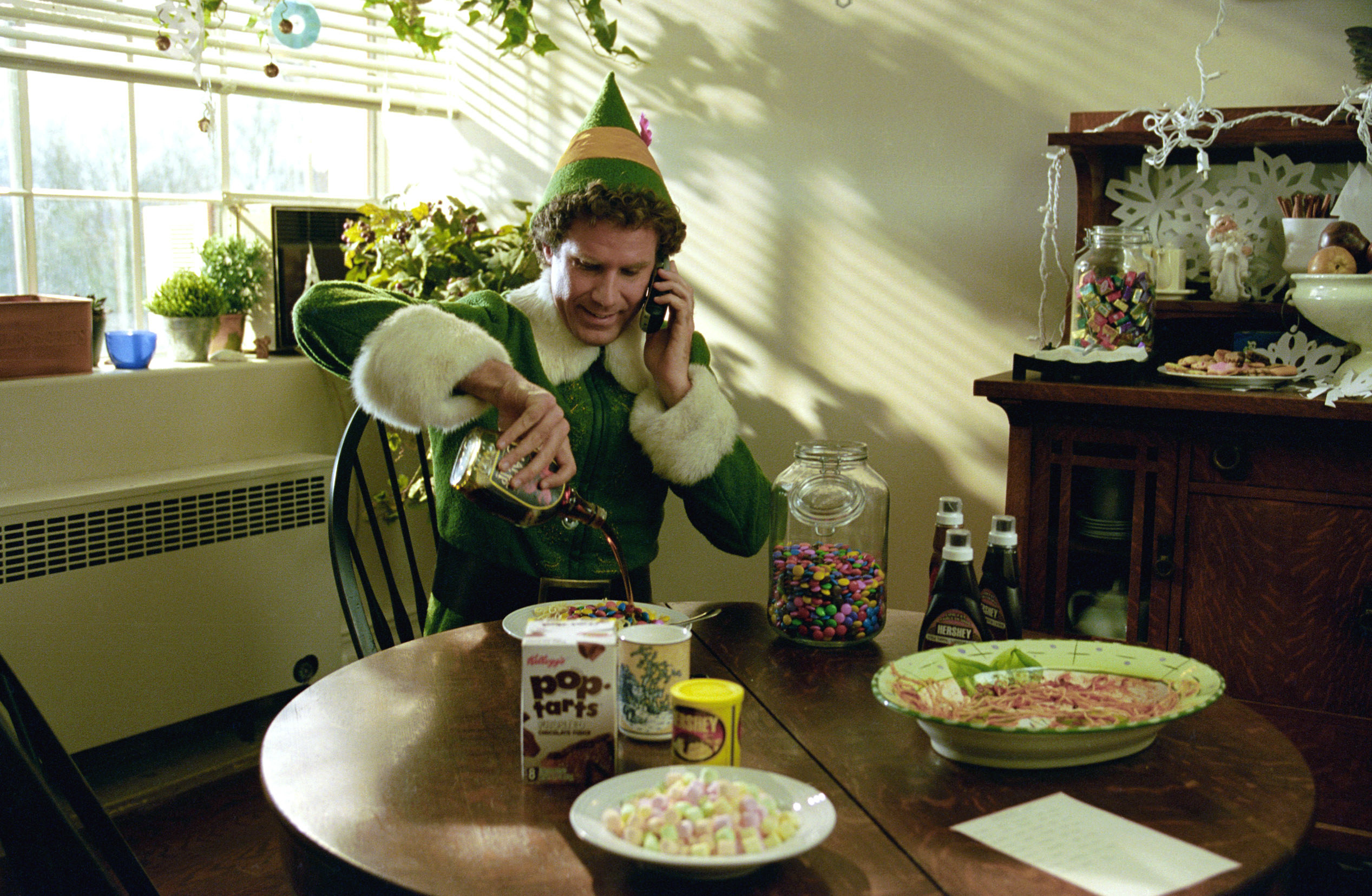 Will Ferrell as Buddy the Elf pouring chocolate syrup on his spaghetti in &quot;Elf&quot;