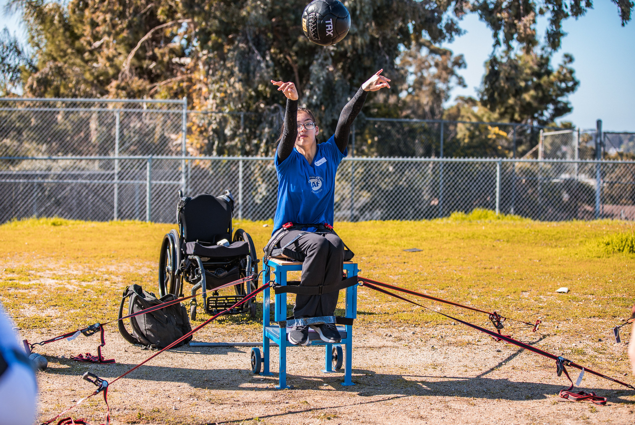 A young girl throwing a ball