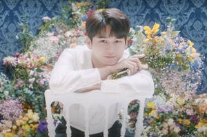 Ong Seongwu poses in the music video for his single "we belong"