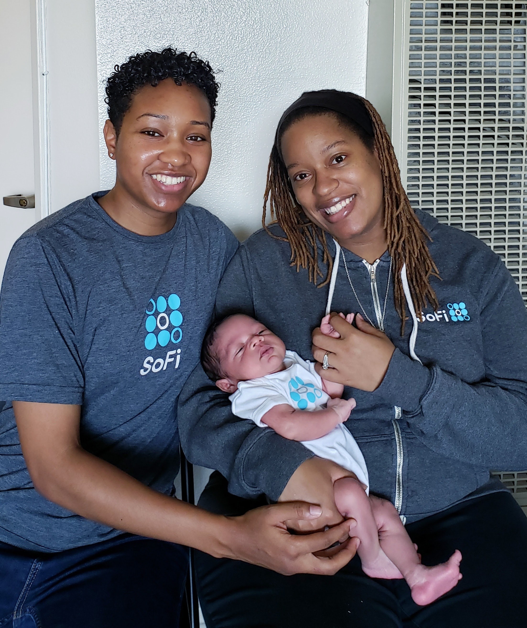Precious and her wife with their baby