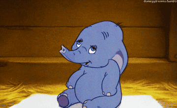 Dumbo, an animated elephant, sneezing as its ears flop