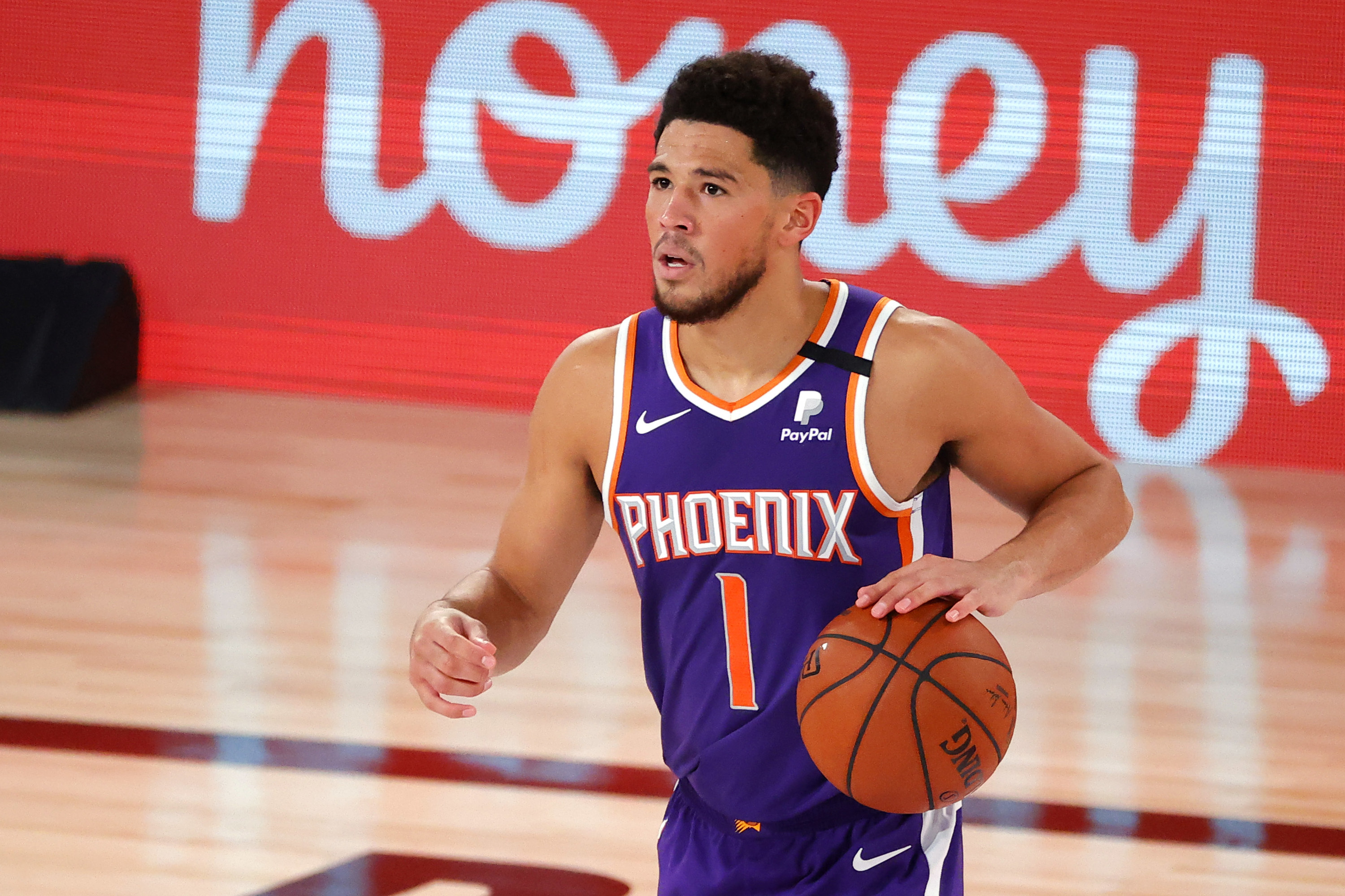 Purple Phoenix jersey with orange numbers and white lettering