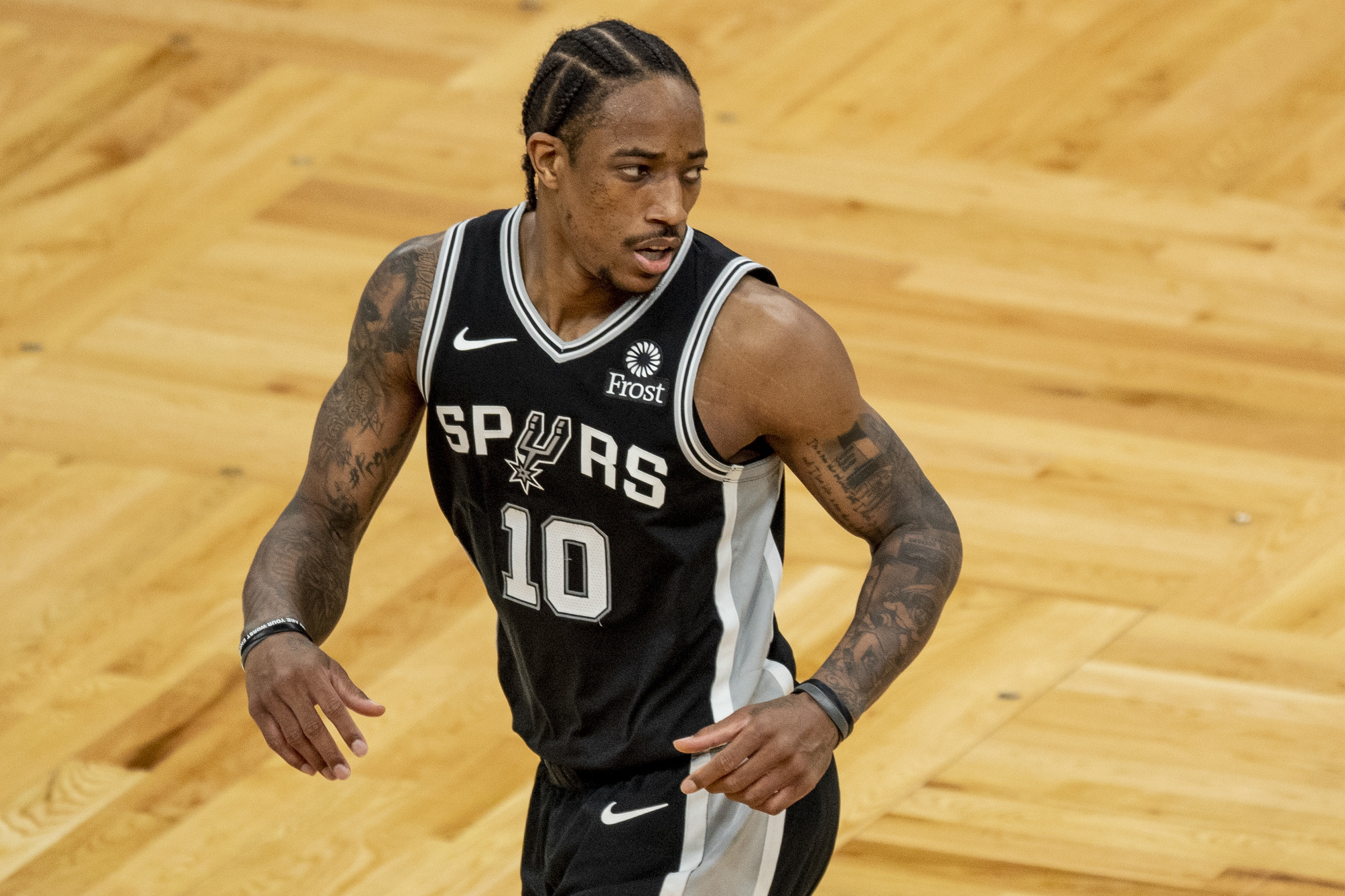Black Spurs jersey with white numbers and lettering