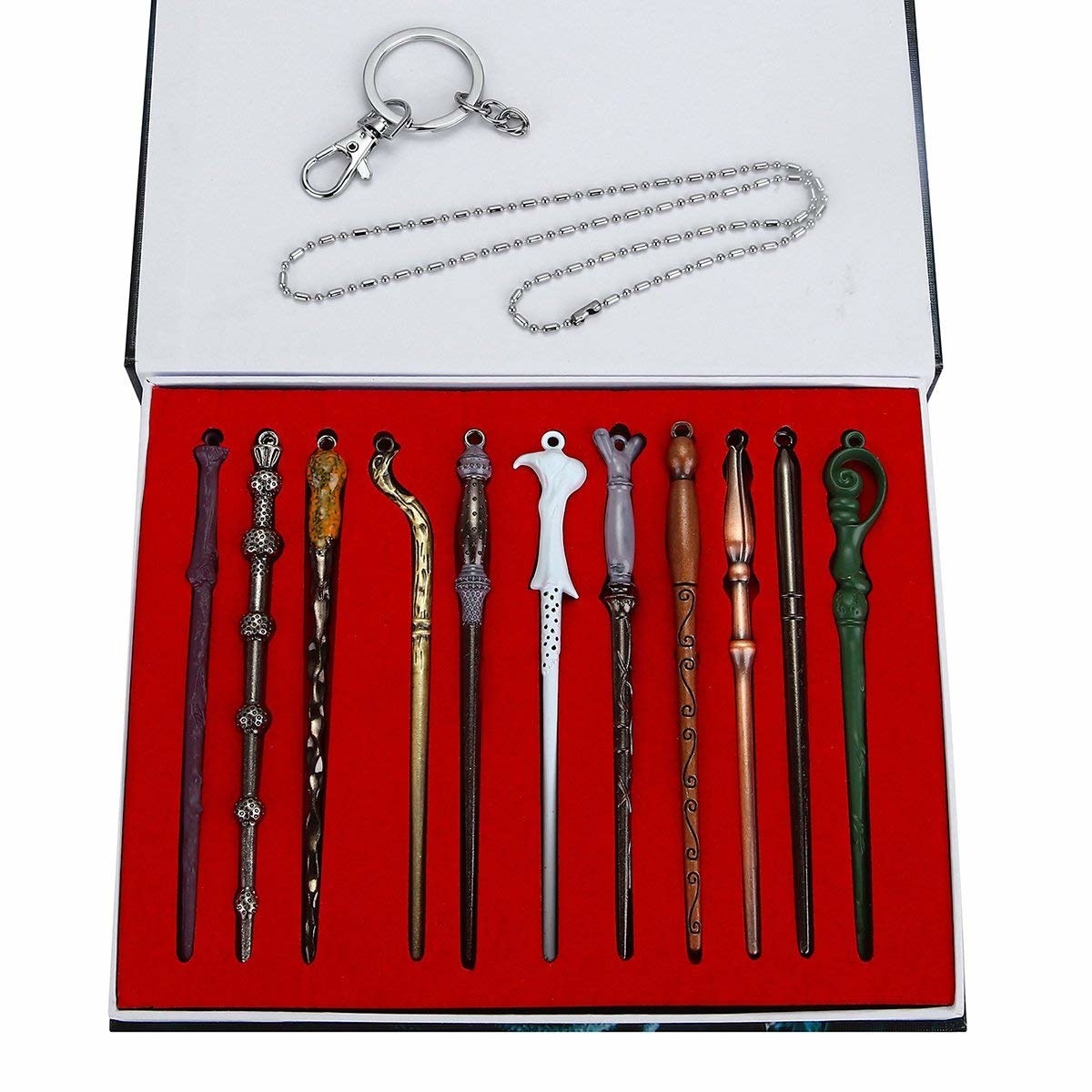 A set of 11 wands from Harry Potter and a keychain and necklace.