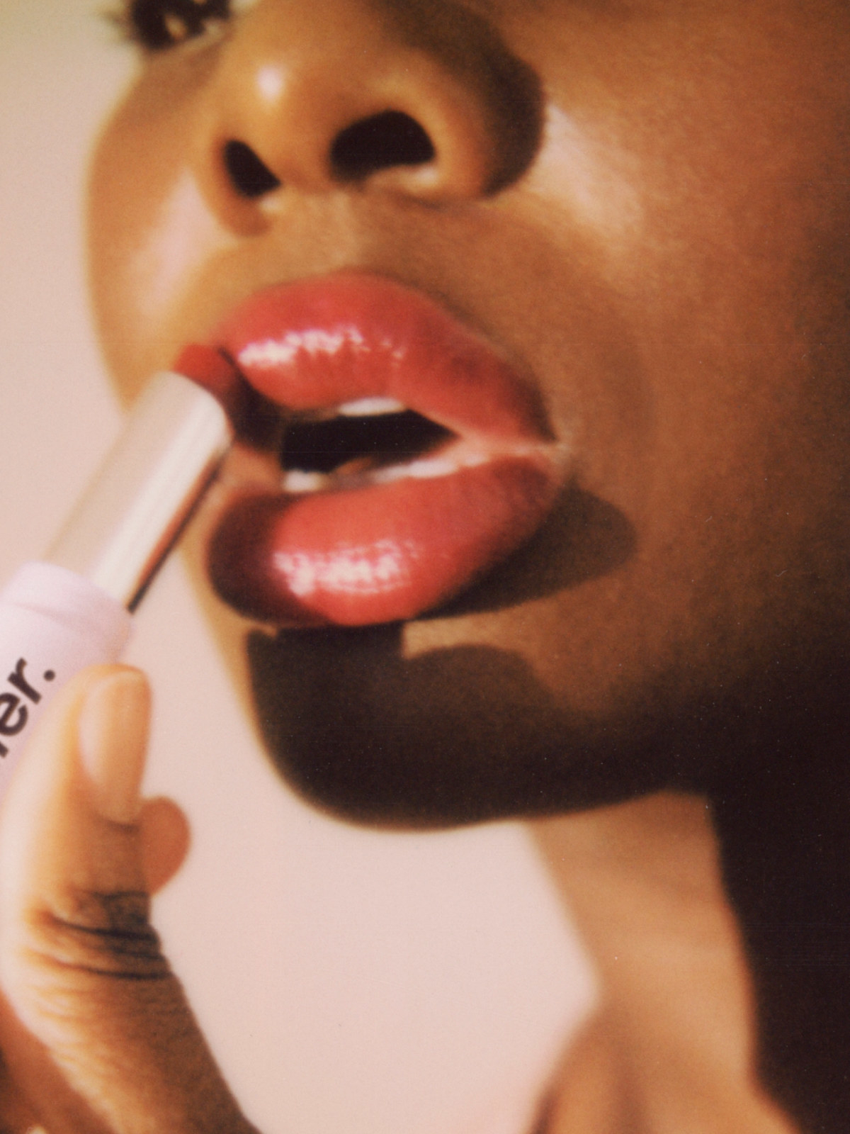 a model applying the lipstick