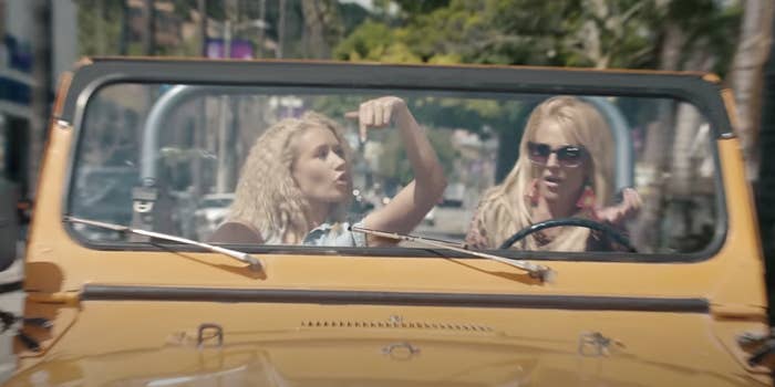 Iggy and Britney driving around in a jeep in their music video