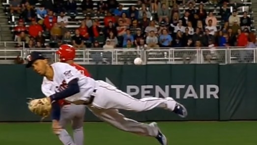 Jorge Polanco falling after throwing a baseball